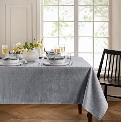 Mantel continental resistente al agua y a las manchas de textura sólida