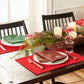 4 red placemats and coordinating mix-matched napkins. Each napkin is different.  The green one says "joy" , the red one says "peace", the red/green plaid 1 says "noel", the red/green plaid 2 says "Merry"