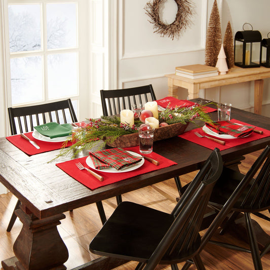 4 red placemats and coordinating mix-matched napkins. Each napkin is different.  The green one says "joy" , the red one says "peace", the red/green plaid 1 says "noel", the red/green plaid 2 says "Merry"